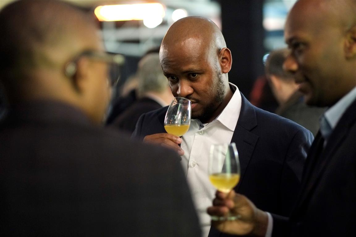 Three men nosing whisky
